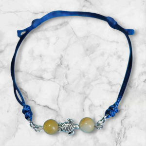 Bracelet œil tigre jaune et tortue de mer